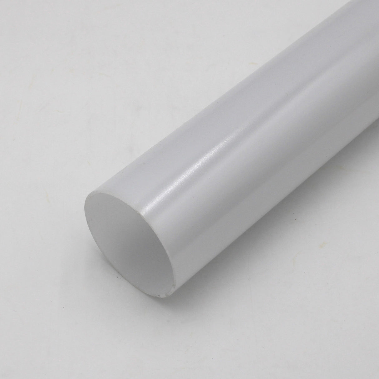 A 2.75 Round Polycarbonate LED Lighting Tube, Model Smokies70, is shown on a plain, light-colored surface at an angle with one end facing the camera.