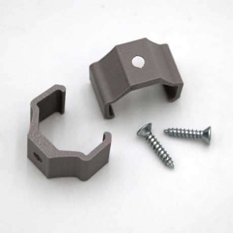 Two gray metal A103 Pair of Clips, each with a mounting hole, are displayed on a white surface with two silver screws. These durable hardware components are perfect for securing objects, and bulk pricing may be available.