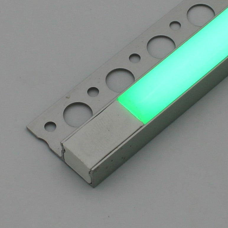A close-up of the RGB LED Tile Edge Light Strip Kit (24V) ~ Nicho Series, showing circular cutouts and a glowing green illuminated section against a plain gray background.