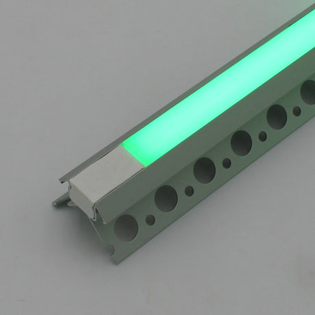 A close-up of the Nicho Series RGB LED Tile Light Strip Kit for Outside Corners (24V) shows its aluminum channel with a glowing green strip, perforated mounting base, and translucent cover.