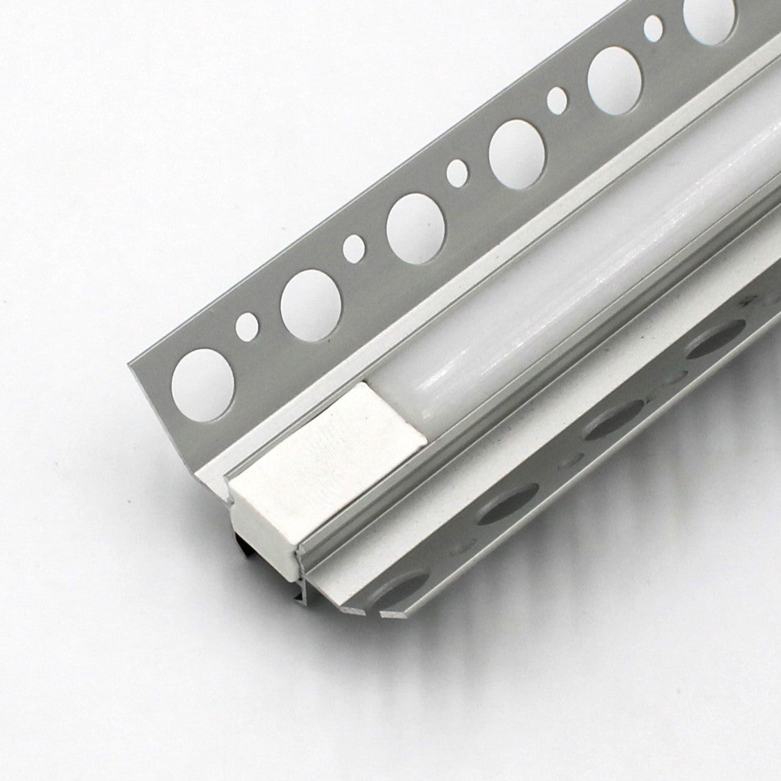 A close-up of the Nicho Series RGB LED Tile Light Strip Kit for Inside Corners (24V), showcasing its silver aluminum housing with circular flange cutouts, set against a plain white background.