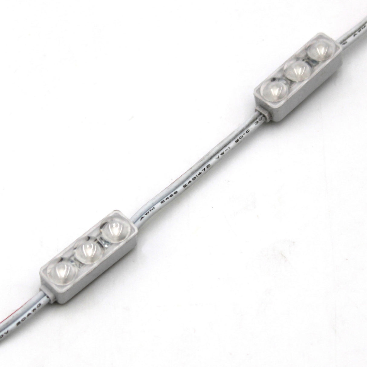 A close-up of the Mini3 Color 160 Mini LED Module ~ Wide Angle Series, IP68 waterproof, shows three LEDs per rectangular module linked by white wire, each with a wide-angle lens, arranged on a white background.