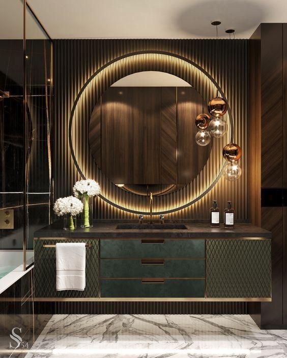 Luxurious vanity setup with warm white LED strip lights framing a round mirror in a high-contrast bathroom design