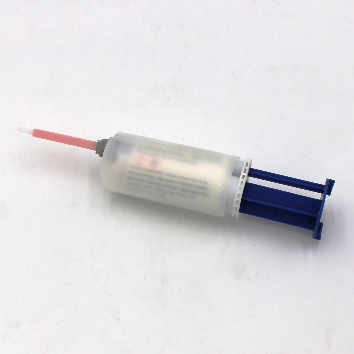 A Caulking Gun Adapter for Methacrylate 50ml 10:1 Mix (Round Flange) rests on a white surface, shown with a pink mixing nozzle and blue plunger for dispensing methacrylate adhesives.