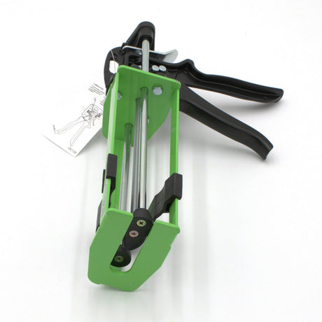 The Manual Cartridge Gun for Methacrylate 400ml 1:1 Mix, in green and black with a metal trigger and handle, is shown on a white background with an attached instruction tag. Designed for use with 400ml adhesive packs.