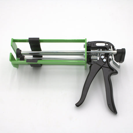 The Manual Cartridge Gun for Methacrylate 400ml 1:1 Mix is a green and black manual applicator with a metal frame and handle, designed for 400ml adhesive packs, shown on a white background.