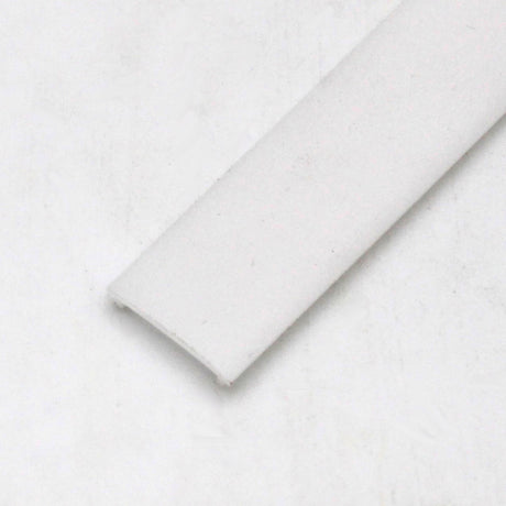 A close-up of the LED Diffuser for Standard Easy-On Profiles, a flat rectangular strip with rounded edges and a polycarbonate finish, shown on a light-colored surface.