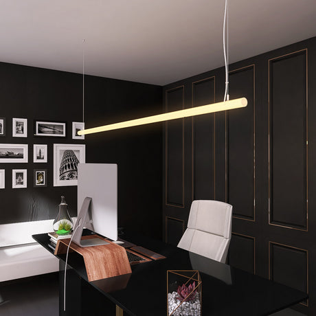 A modern office with a black desk, white chair, computer, and desk accessories. Above hangs the Cascade38 1.50 Round Acrylic Outdoor LED Lighting Tube; black walls are adorned with picture frames displaying black and white photos.