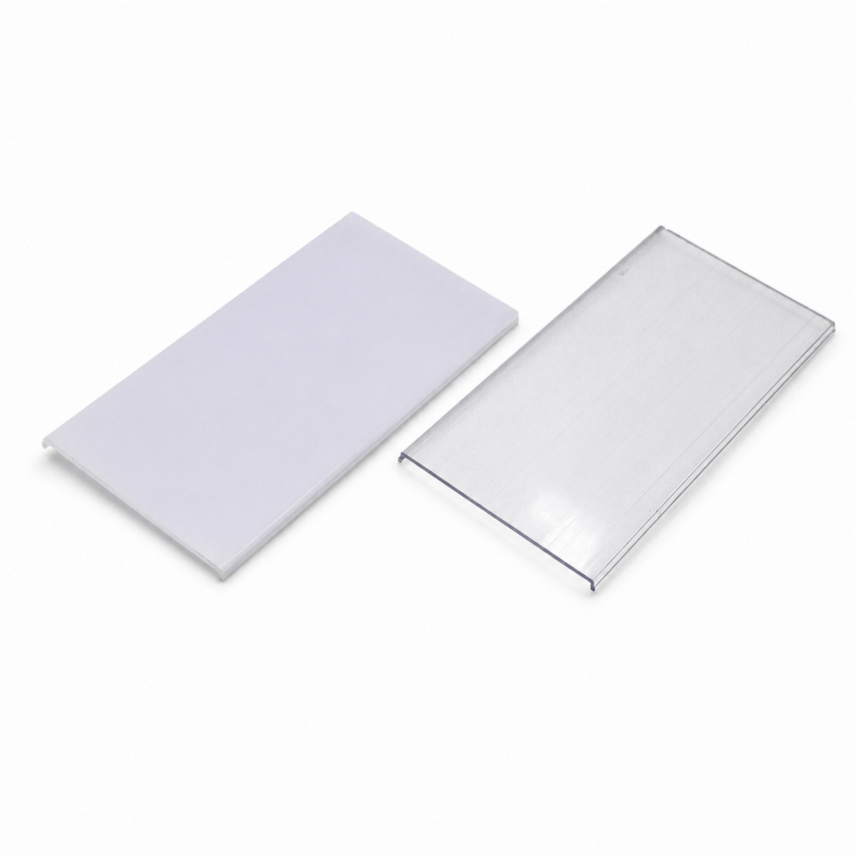 Two rectangular plastic sheets designed as diffusers for PLW80N, RPLW80, RPLW80-FL, and Alu-Triangle series profiles are displayed on a white background—one with a solid white, opaque finish serving as a diffuser and the other with a transparent surface allowing clear visibility through it.
