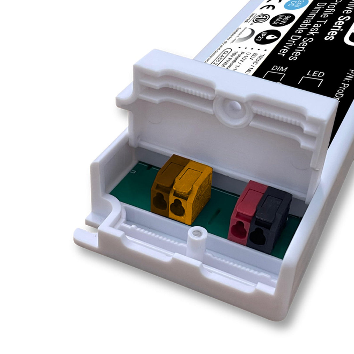A close-up of the EnoLED ProDrive Series 5-in-1 Dimmable LED Driver (24V) shows its white plastic casing open to reveal yellow, red, and black terminal blocks mounted on a green circuit board inside the low-profile device.