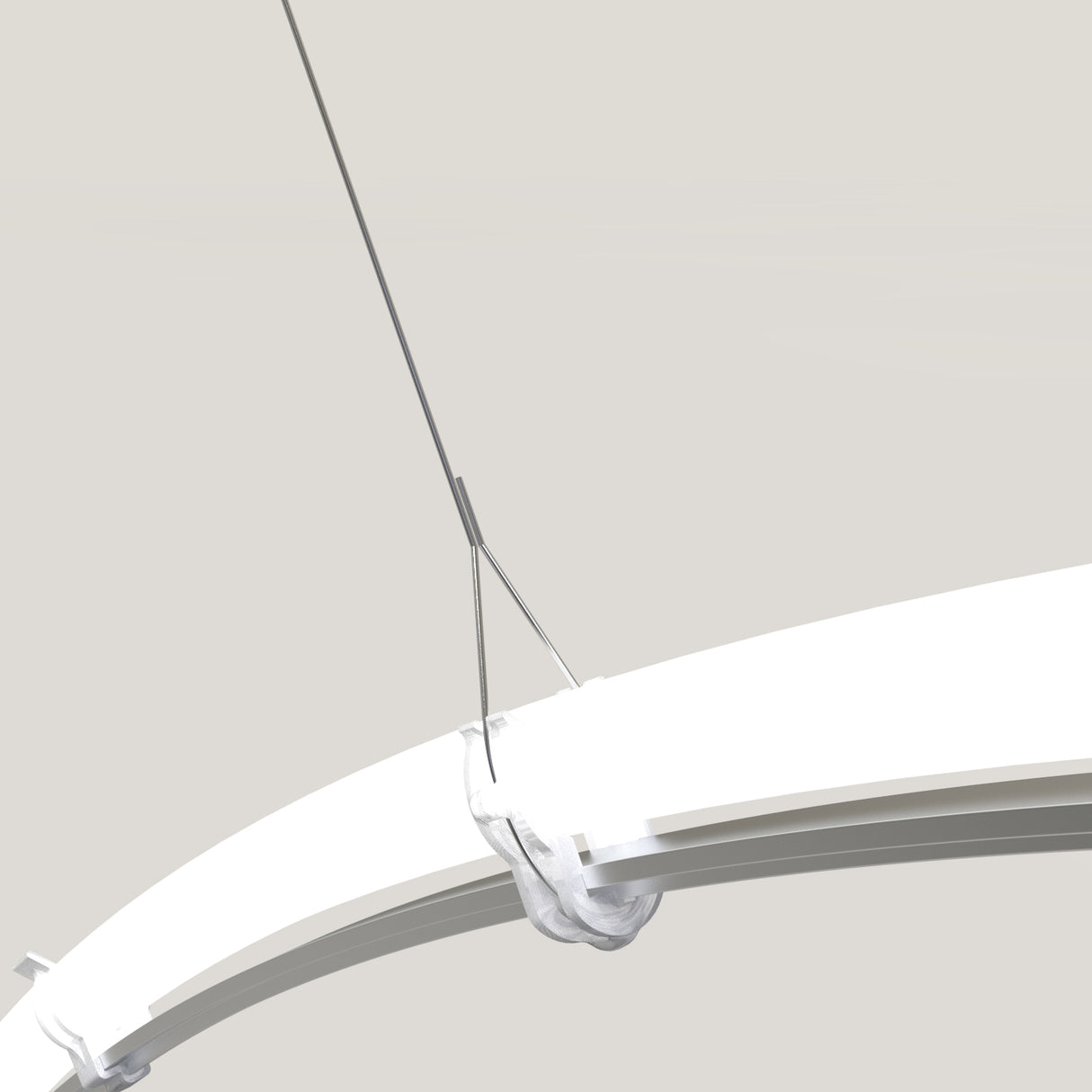 A close-up of the T-Mount Clip for Redondo XL shows it securing a suspended Neon Redondo XL circular light fixture with metal cables, set against a plain background to highlight the clean, modern design.