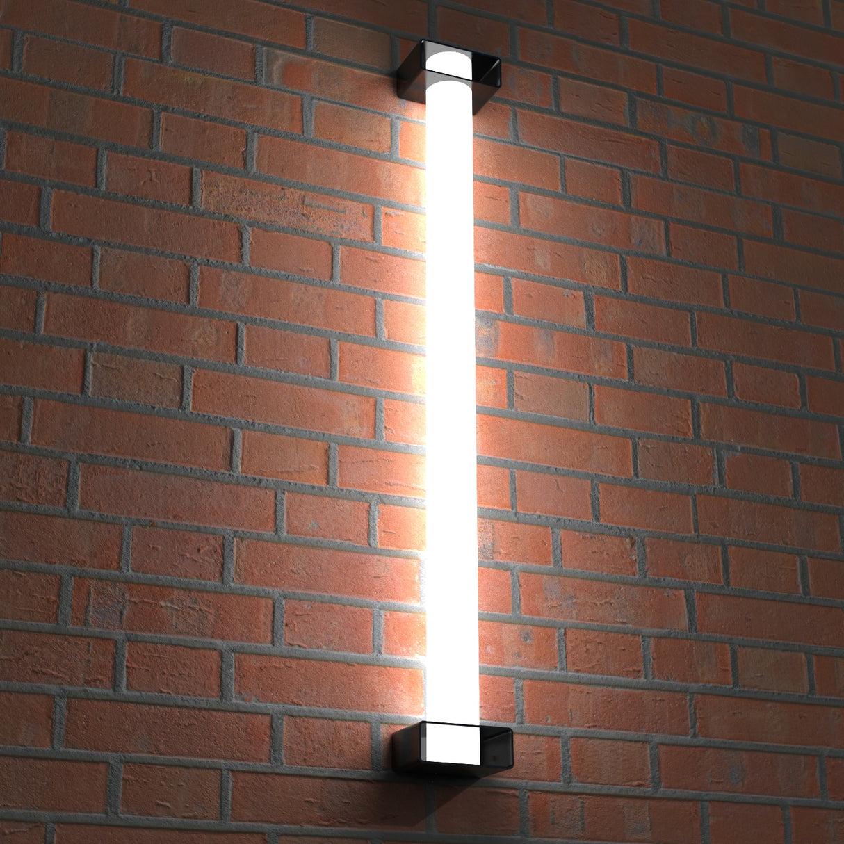 A Surface Mounting Bracket for 2.56 Round Profiles supports a bright vertical outdoor light fixture on a red brick wall, with the fixture glowing intensely and softly illuminating the surrounding bricks.
