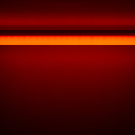 The Colored Border Contour Tube Light ~ Hi-Lite 30 Straight Section casts a horizontal orange-red glow on a dark red wall, forming a vivid bright band at the top that gradually fades into deeper red shades below.
