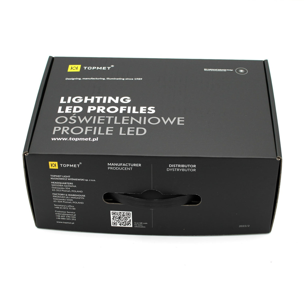 A black rectangular box labeled LED Channel Sample Case by TOPMET, displaying contact info, QR code, distributor details in English and Polish, plus samples of architectural and aluminum profiles.