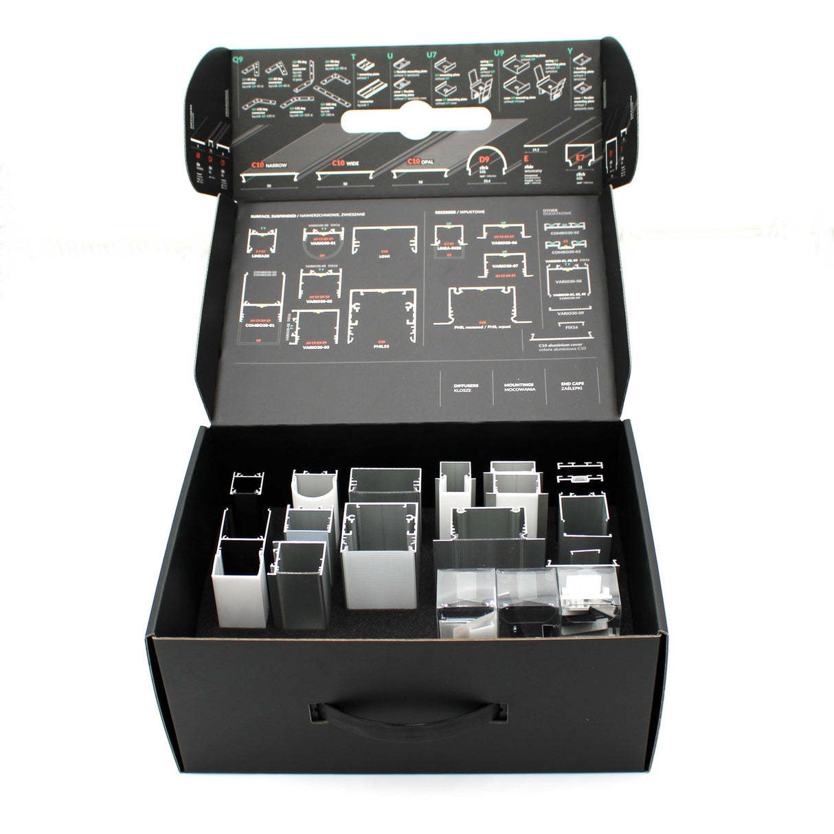 The LED Channel Sample Case is an open black box featuring neatly organized compartments with aluminum profile samples, metal or plastic parts, and assembly instructions printed on the inside lid.