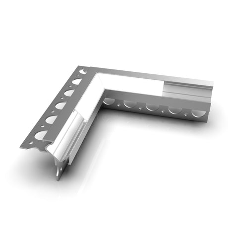 The Corner Connector for Uni-Tile12 270 Profile is a silver, L-shaped metal corner piece with round perforations on one side and a white insert along the inner edge, designed as a finishing edge or connector in construction projects.