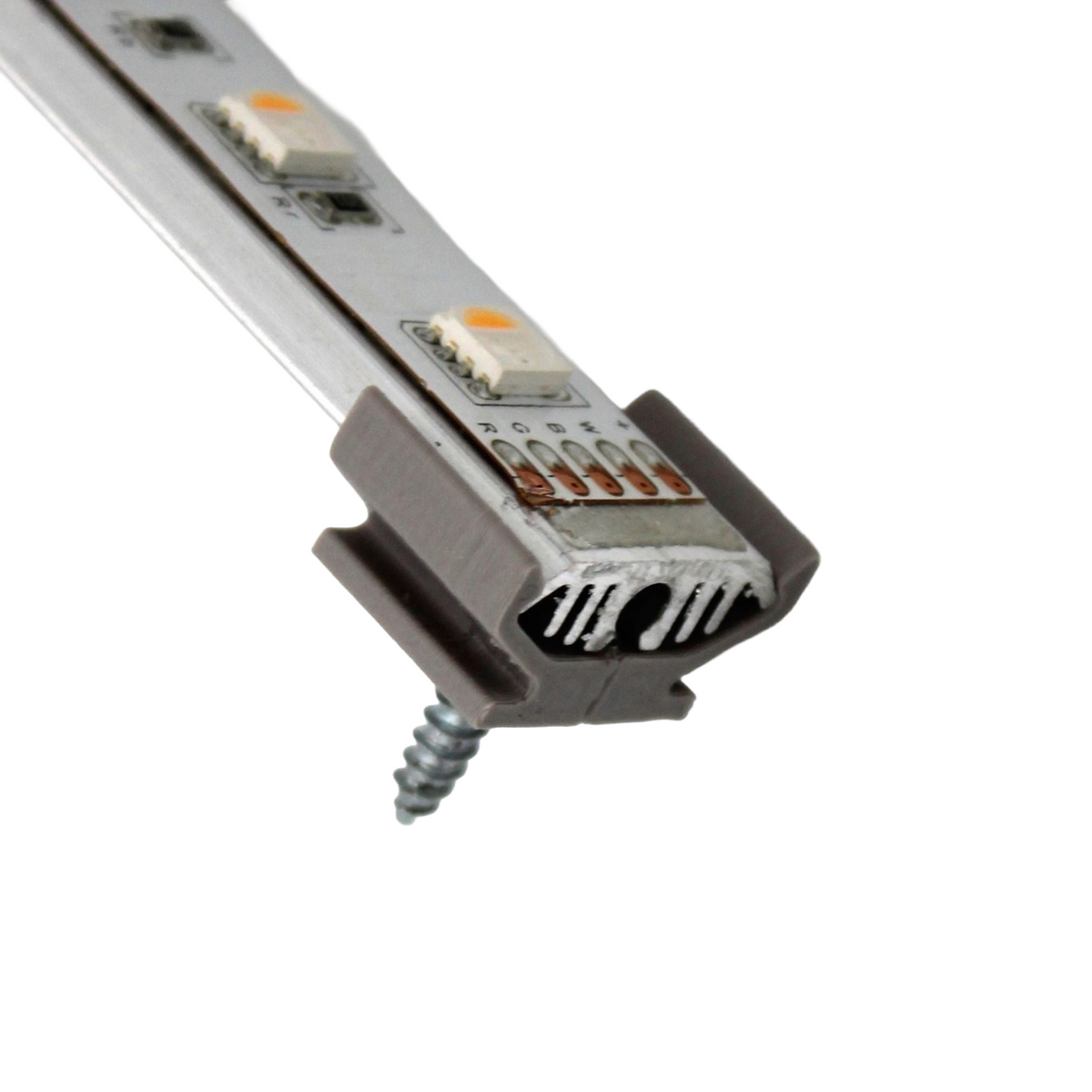 Close-up of a Surface Mount for Yukon Profile showing an LED strip inside an aluminum channel with a plastic diffuser, secured with a screw and 3D printed mounting accessories, against a white background.