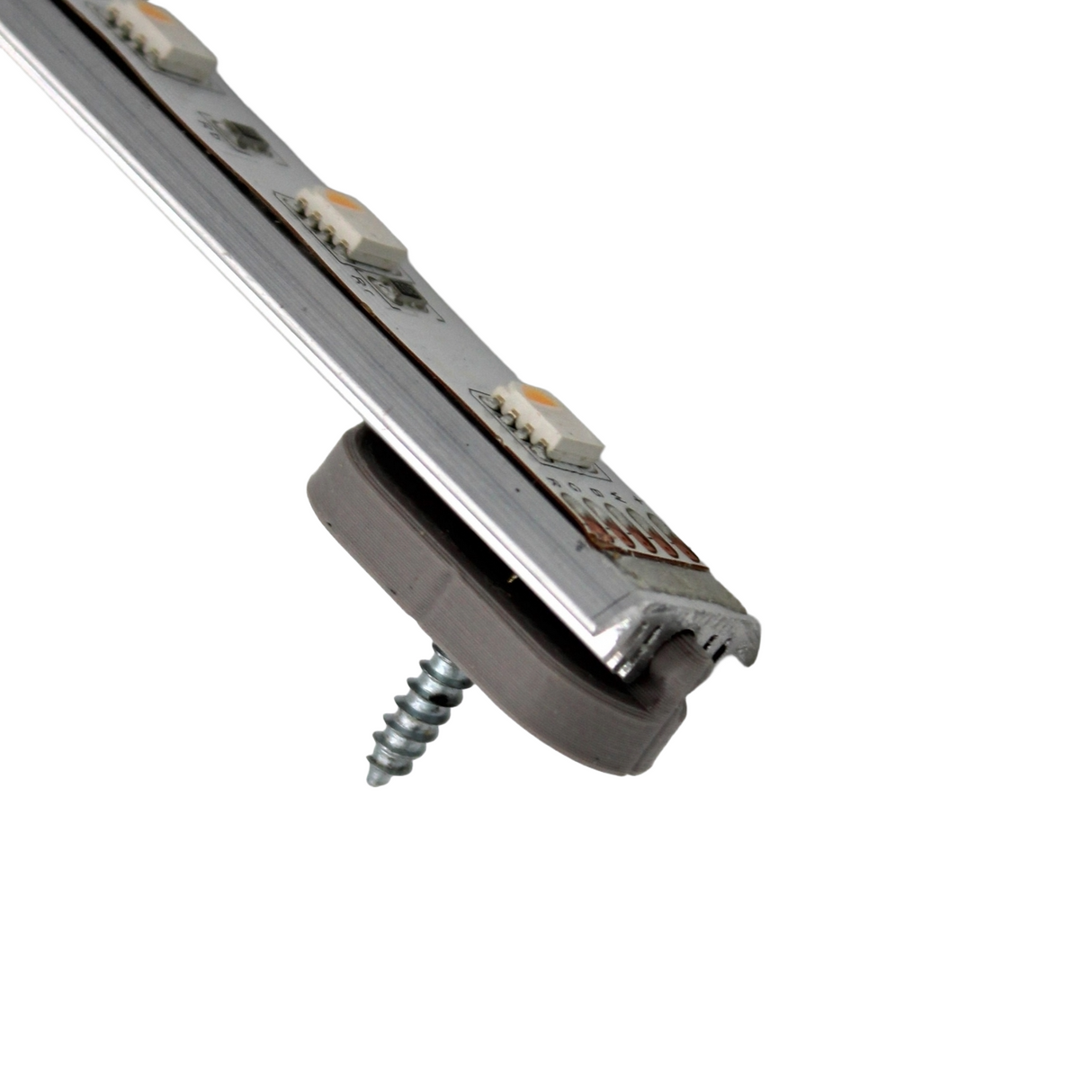 A close-up of the Surface Mount for Yukon Profile shows it attached to an aluminum rail with a gray plastic bracket and metal screw, all set against a plain white background to highlight its easy-to-install surface mount accessories.