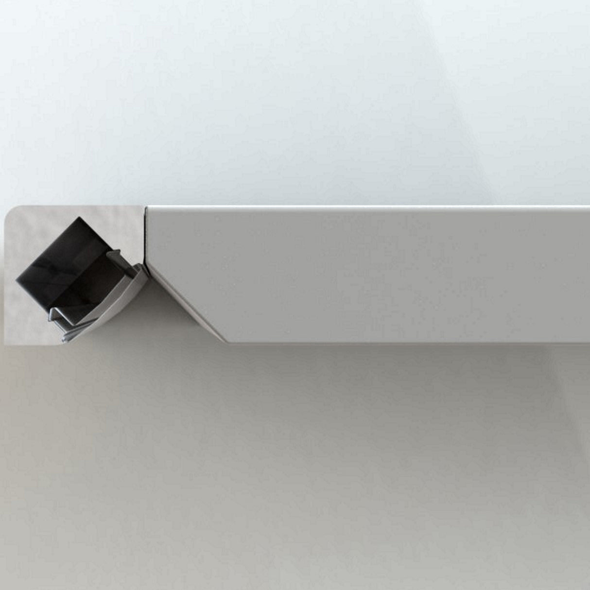 The 45 Degree Corner Mount LED Channel ~ Model ALU-45 is a minimalist metal shelf with a rectangular cut-out at one end, holding a small closed black book positioned diagonally. The light gray shelf is ideal for LED lighting applications.