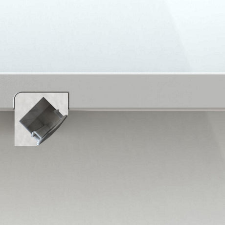 A square, silver clamp is attached to the corner of a light gray table to secure and mount the 45 Degree Corner Mount LED Channel, Model ALU-45, for LED lighting. The table and background share the same color.