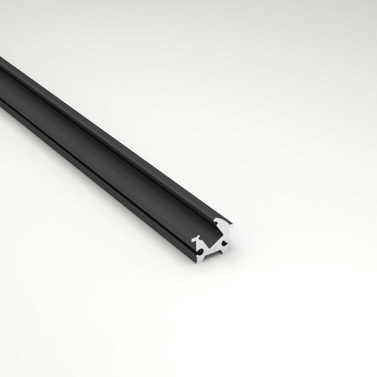 The Recessed Angular LED Channel ~ Model Amsterdam Mini is displayed on a light, neutral background, shown at an angle to emphasize its distinct shape and channels.