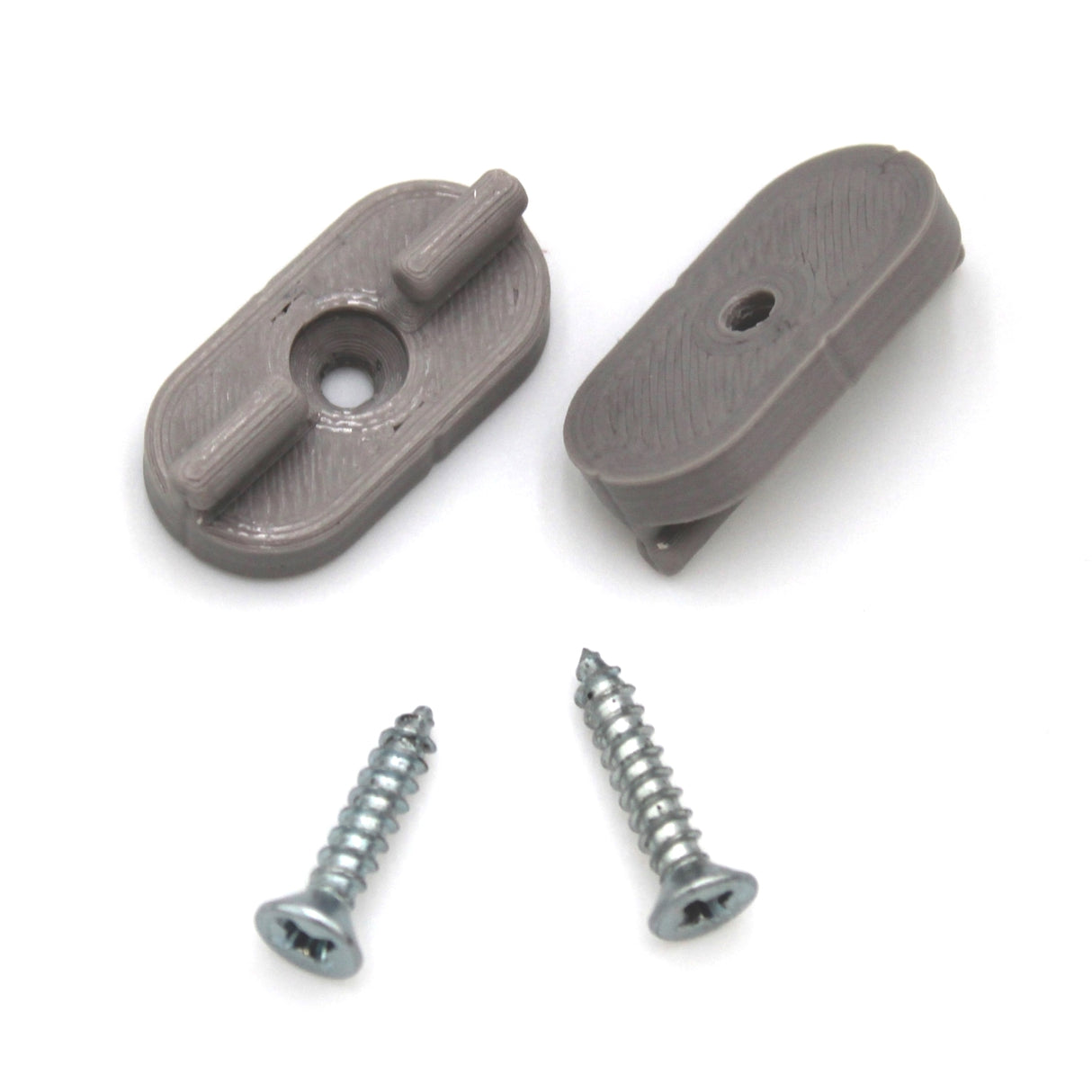 Two gray oval Surface Mounts for Yukon Profile and two silver screws are displayed on a white background. Each mount features a central hole and raised pegs, with screws placed below.