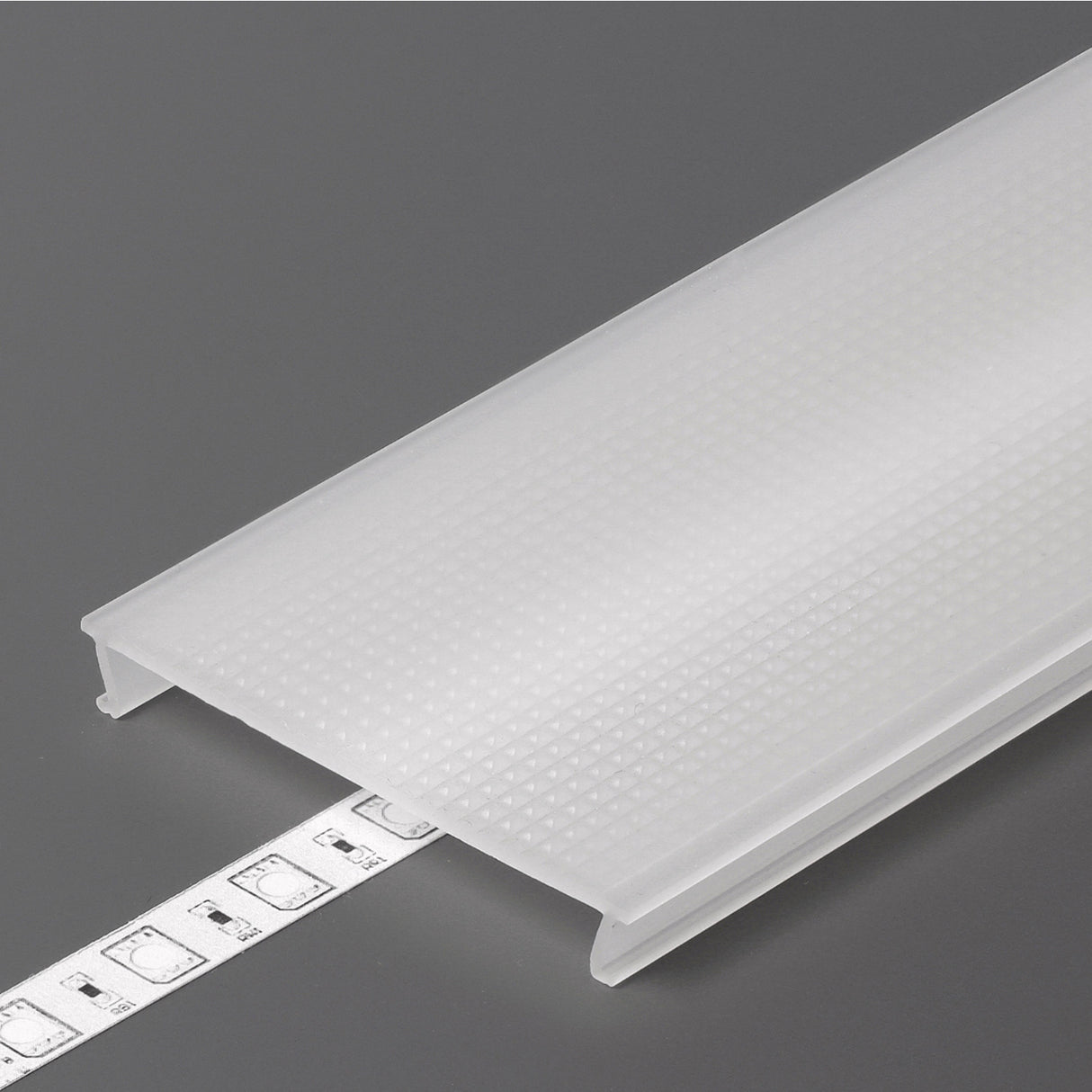A frosted, textured opal PMMA diffuser cover like the LED Channel Cover ~ C10 Click partially conceals an LED strip light on a gray background.