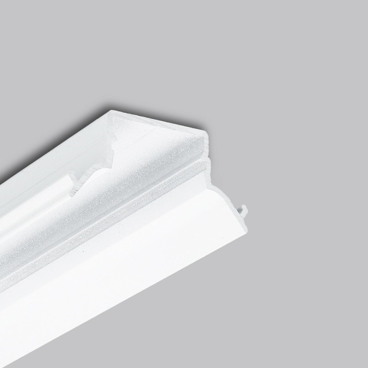 White decorative architectural molding featuring a Complementary Profile ~ Model Pixel33-04 with a stepped LED profile for recessed light trays.