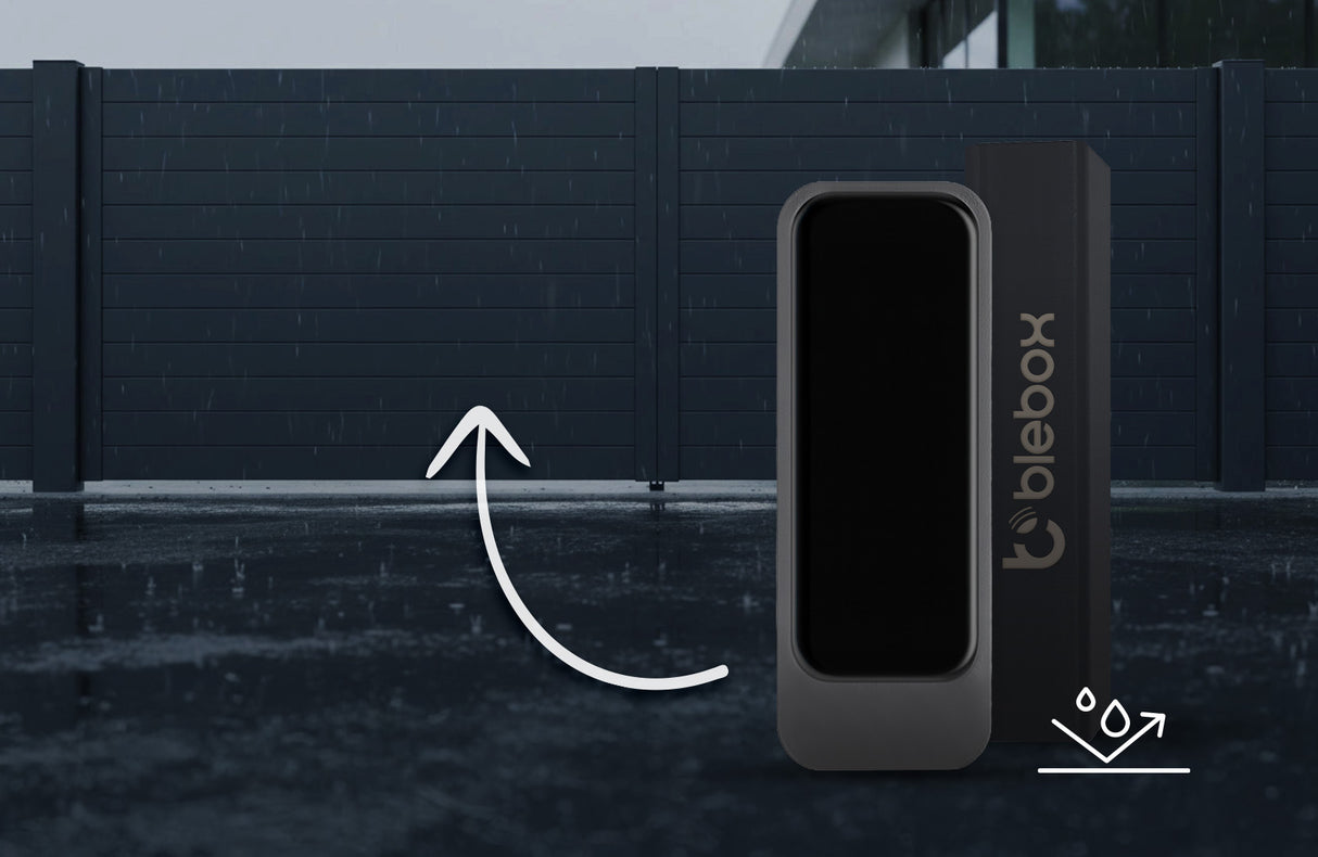 A Smart Magnetic Accessory for openSensor, the twinMagnet by Blebox, is shown in front, with an arrow highlighting a closed modern gate in the background. The wet ground suggests recent rain.