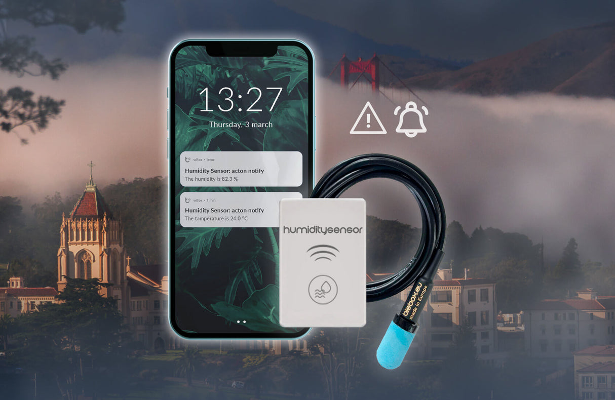 A smartphone shows alerts from the Smart Wi-Fi Air Temperature and Humidity Sensor ~ humiditySensor by Blebox. The device, featuring a blue-tipped probe and cable, sits in front of a foggy cityscape with the Golden Gate Bridge and alert icons.