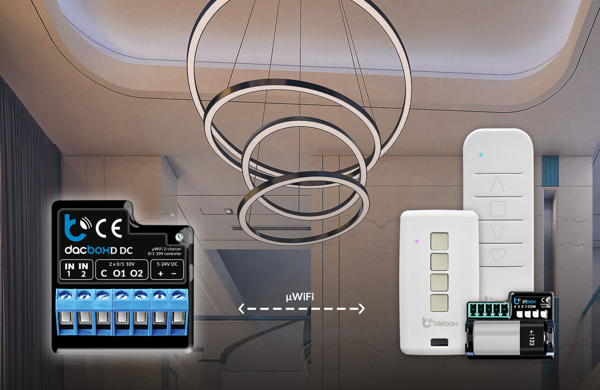 A modern chandelier hangs from a ceiling with recessed lights. In the foreground is the Smart WiFi 2-Channel 0-10V Controller, Model dacBoxD DC, featuring remote control and terminals connected by a WiFi-labeled dashed line.