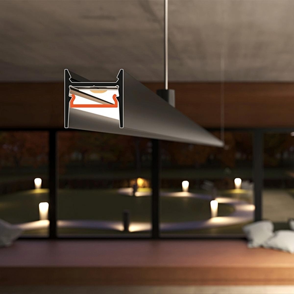 The Small Anti-Glare Lighting LED Channel ~ Model Cozy12 is a modern, suspended linear fixture with low-glare design, shown in a dimly lit room with large windows overlooking an outdoor space and a cutaway revealing its internal wiring.