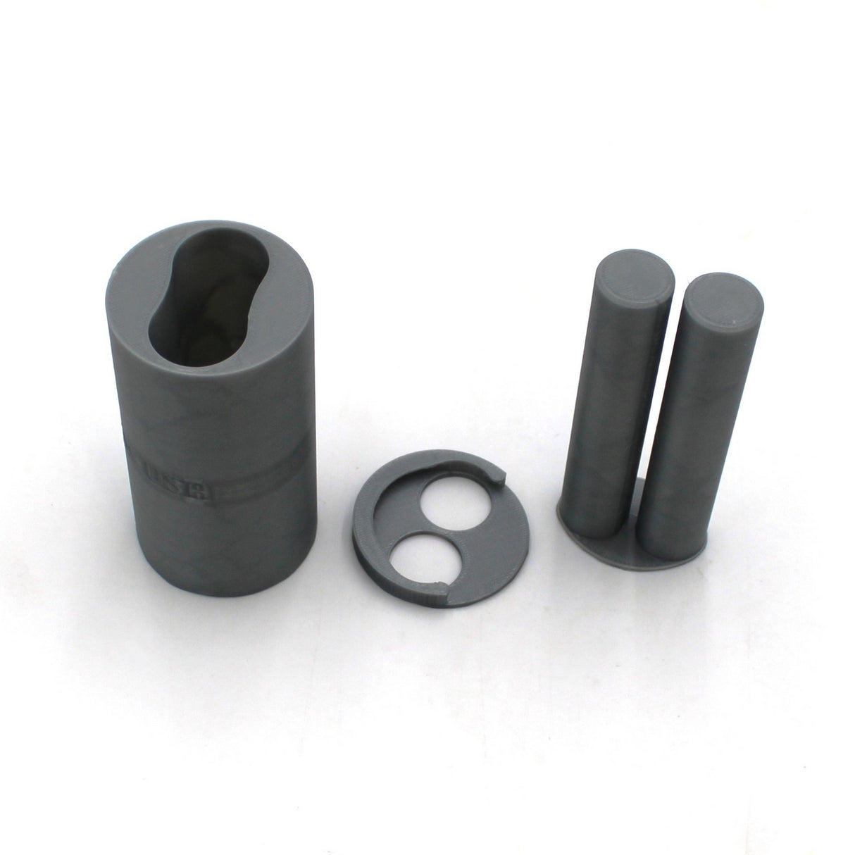 Three gray 3D-Printed Caulking Gun Adapters for Methacrylate 50ml 1:1 Mix, varying in height, and a circular disc with two holes are displayed on a white background.