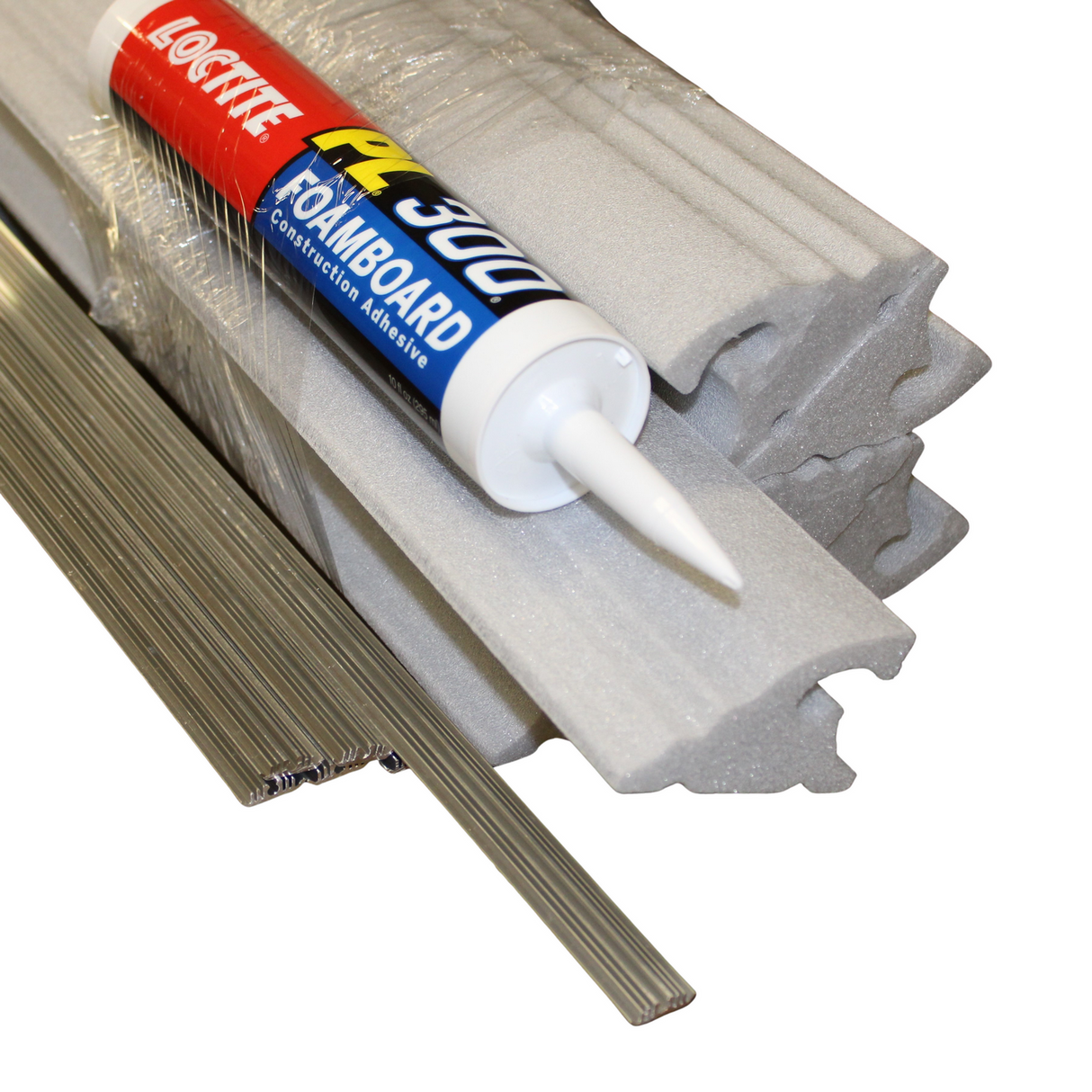 A tube of Loctite construction adhesive sits on foam insulation boards and metal strips, next to LED Foam CoveLight Molding (Model Cornice CoveLight), all wrapped in plastic.