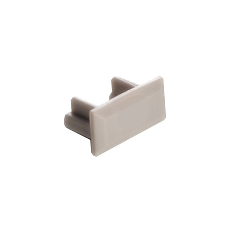 The End Cap for Milano Slim Profile is a small, rectangular, light gray plastic accessory with two prongs that easily snaps into and covers the open end of a Milano Slim Profile lighting fixture or rectangular tube.