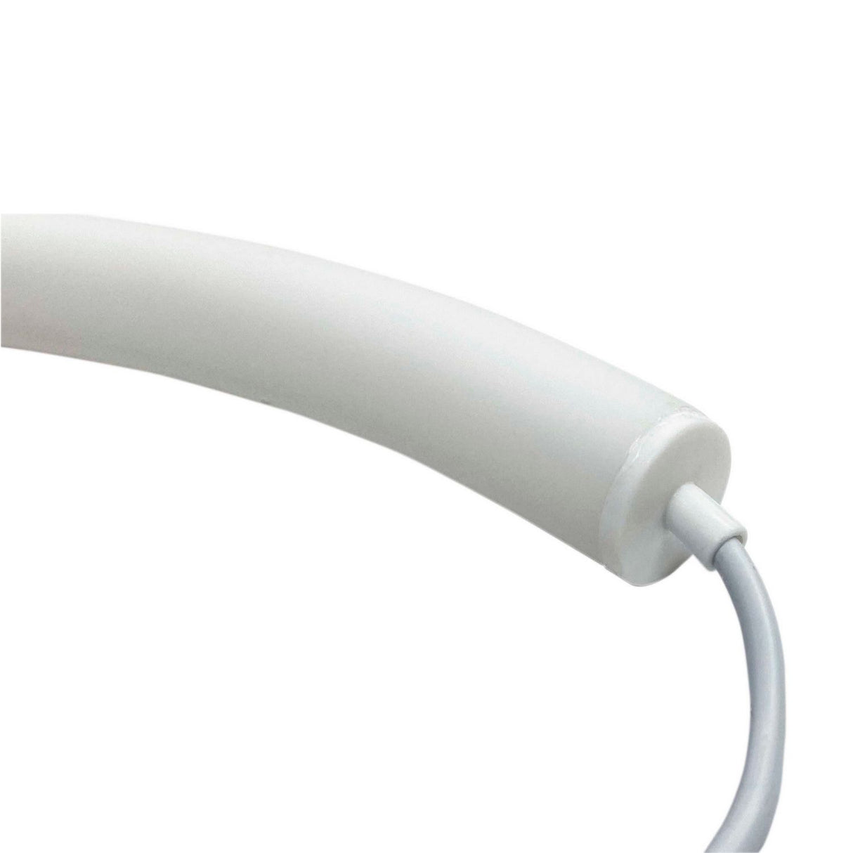 Close-up of a white, curved plastic tube with end caps and a cable emerging from one end against a plain background—featuring the End Cap for Neon 360 Series lighting fixture.