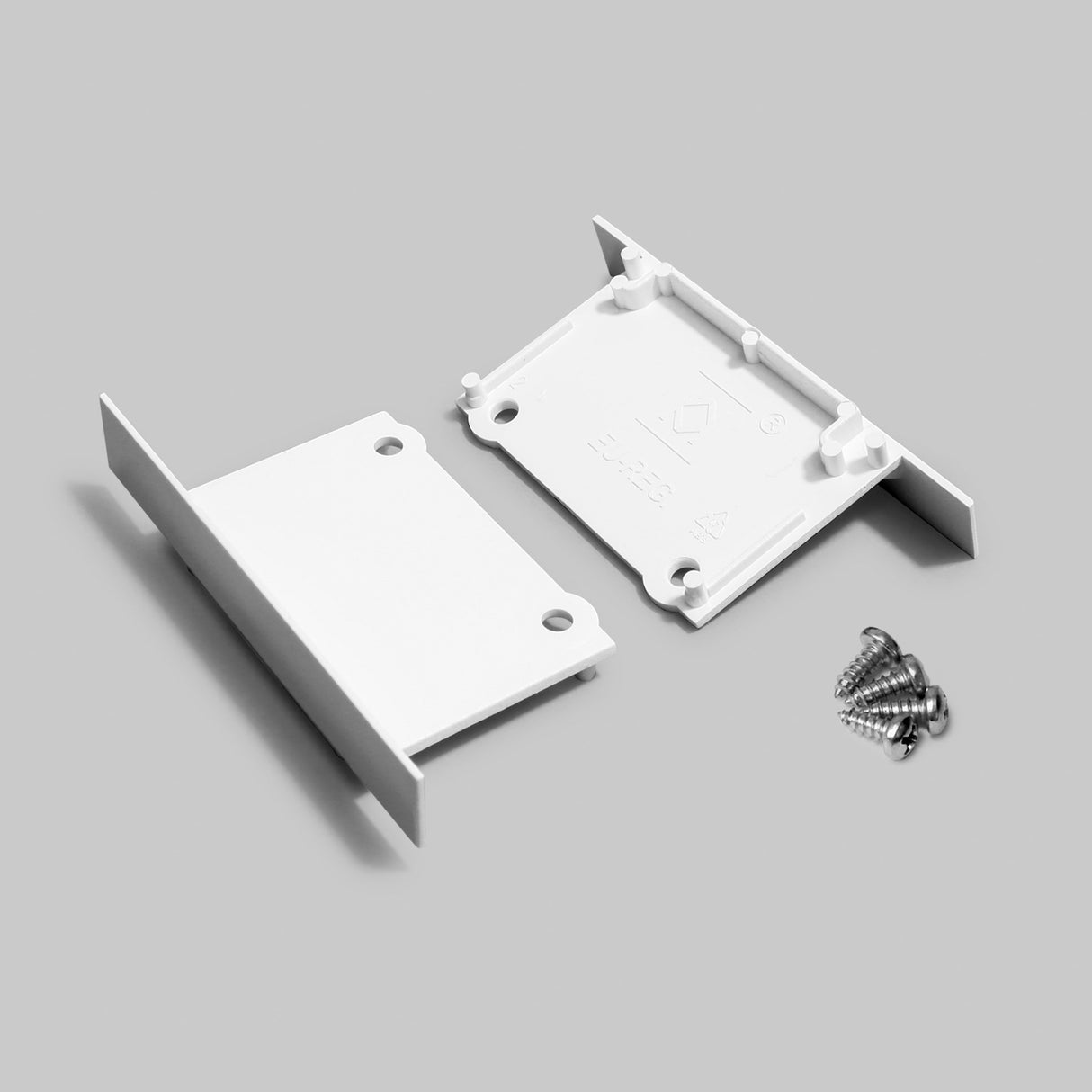 The Plastic End Cap for Phil Recessed Profile is a white wall-mount bracket in two parts, includes silver screws, and is shown on a light gray background.