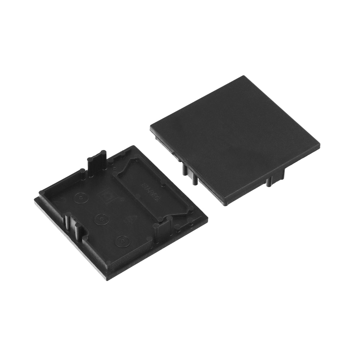 Two black plastic End Caps for Phil.v2 Profile are shown—one flat displaying the inside, and one upside down showing the outside—suitable as battery covers or for closing Phil.v2 profile lighting fixtures.