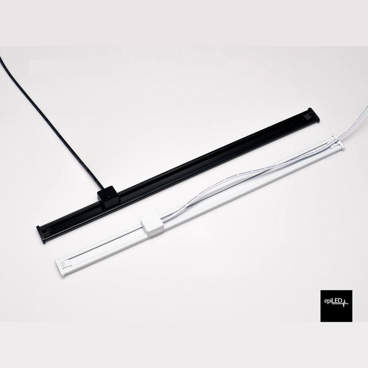 Two Power Track Twist Plug Connectors, one black and one white, are placed parallel on a white surface with visible power plug connectors. The epiLED logo appears in the bottom right corner.