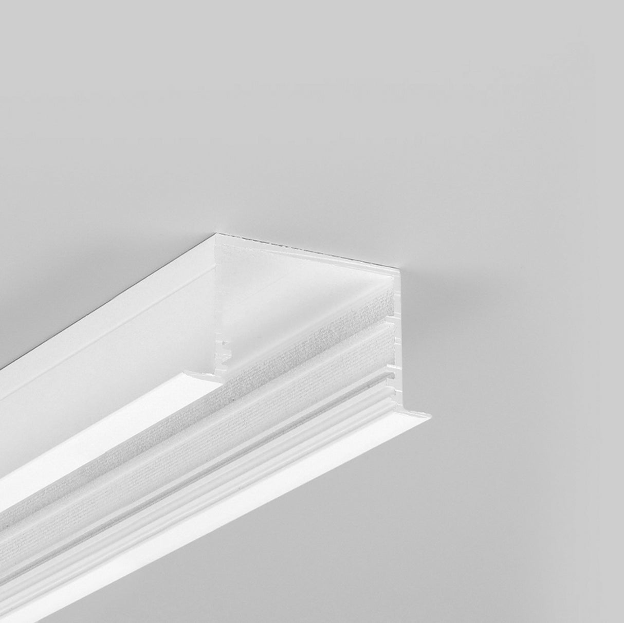 A close-up of the 1.3” Deep-Section Recessed LED Channel ~ Model Vario30-07, installed against a light gray ceiling, showcases clean lines and a modern, minimalist design for seamless, integrated indoor lighting.