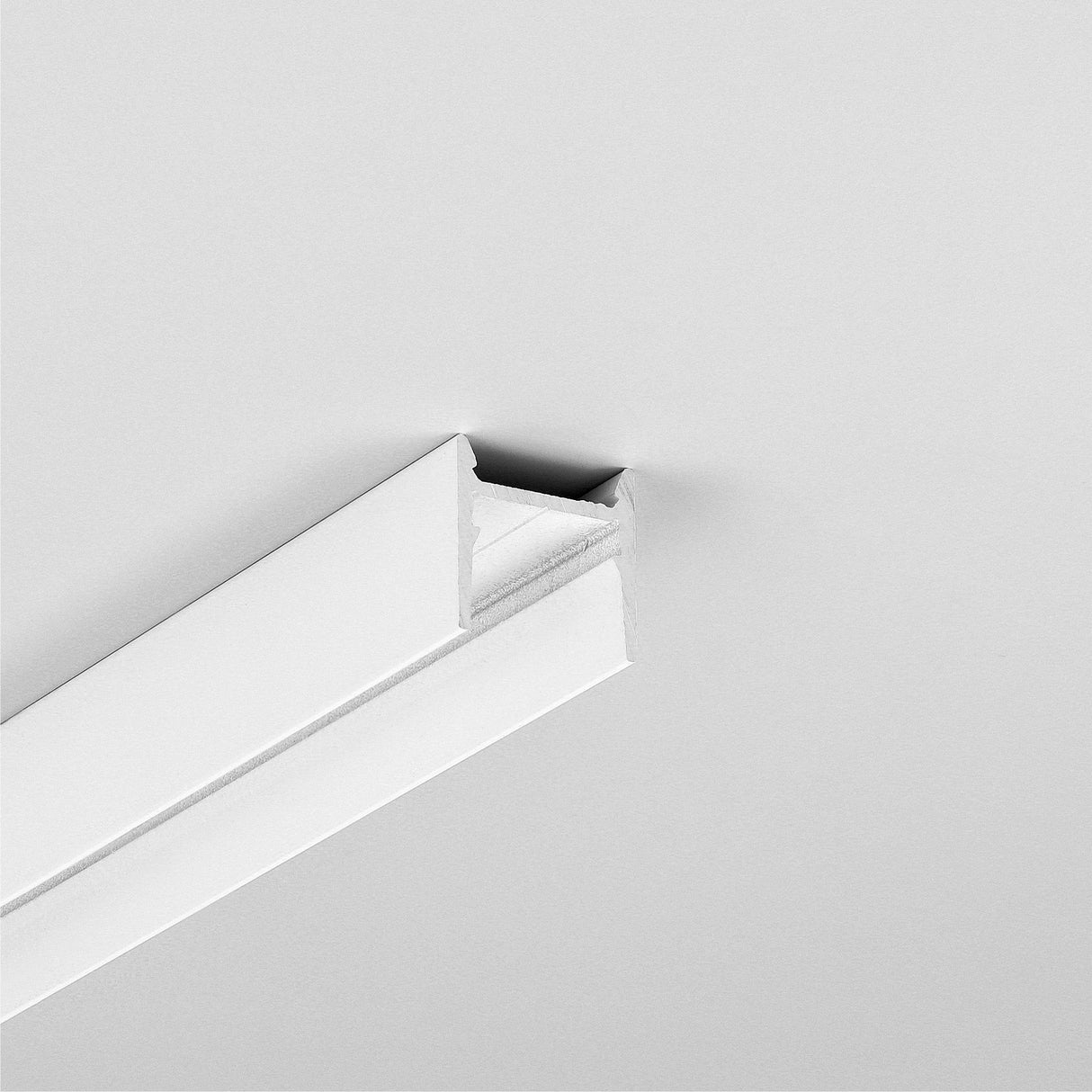 Minimalist image of the Small Anti-Glare Lighting LED Channel ~ Model Cozy12, recessed into a smooth, light ceiling for soft illumination with clean lines and a modern design.