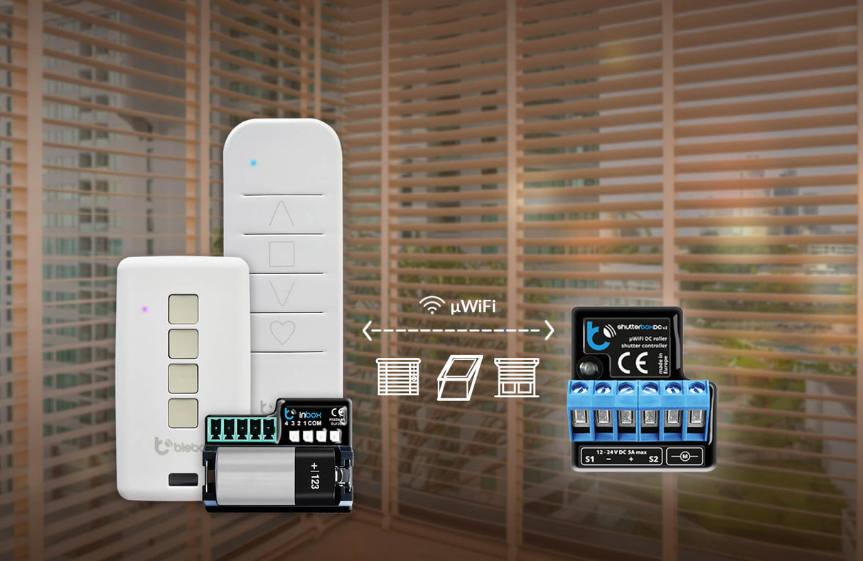 The shutterBoxDC by Blebox, a Smart Wireless Roller Blind/Shutter Controller, is displayed with remote controls before window blinds, highlighting wireless automation, seamless connectivity, and intelligent commands via the WiFi symbol and icons.