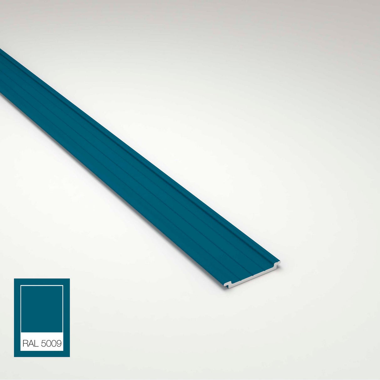 A teal blue Complementary Profile for Antonio, Lola and Ricardo Profiles with grooves runs diagonally on a light surface. In the lower left corner, a color swatch labeled RAL 5009 matches the profiles teal blue shade.