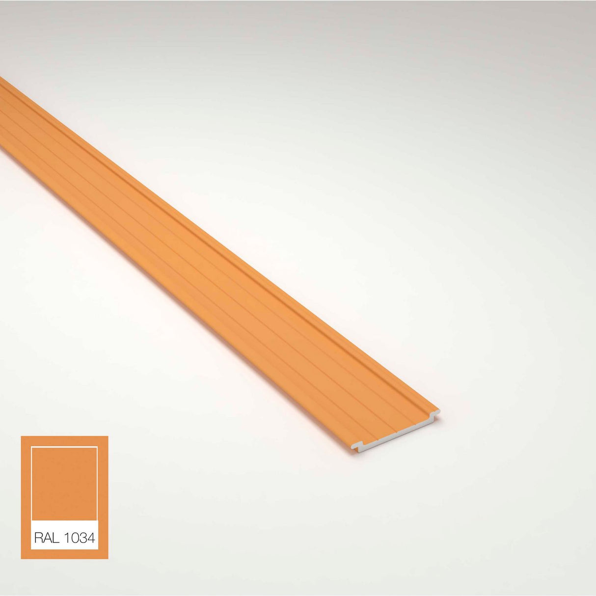 An orange Complementary Profile for Antonio, Lola, and Ricardo Profiles lies on a white surface. In the corner, a color swatch labeled RAL 1034 matches the profile’s shade.