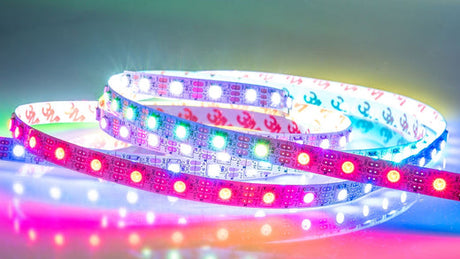 Coiled RGB LED strip lights showcasing multi-color output and chip density for indoor lighting applications – Wired4Signs USA