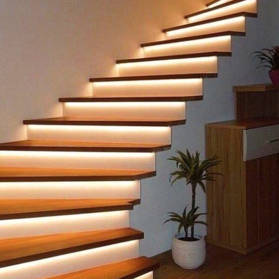 Wood residential staircase with LED lighting under each tread