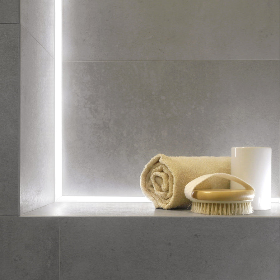 LED illuminated shower niche with integrated tile-edge lighting