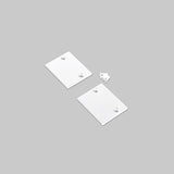 Two rectangular white End Cap for Pixel33-01 Profile pieces with corner holes, plus one small, uniquely shaped metal piece, displayed on a plain light gray background.