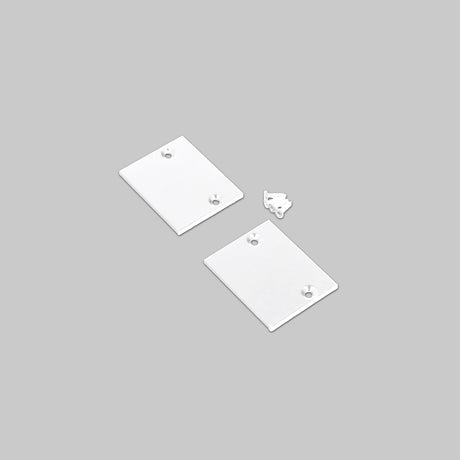 Two rectangular white End Cap for Pixel33-01 Profile pieces with corner holes, plus one small, uniquely shaped metal piece, displayed on a plain light gray background.