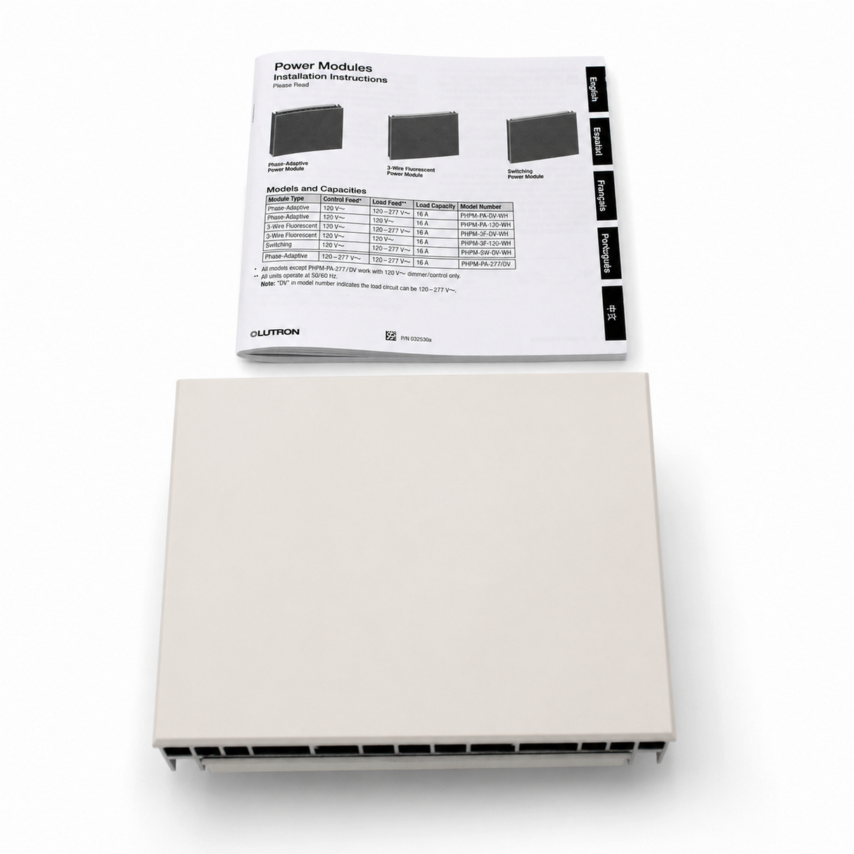 A beige rectangular electronic device, identified as the Single-Zone Dimming Interface Lutron Phase-Adaptive Power Module (Model PHPM-PA-120-WH), sits below a sheet of installation instructions for Lutron Power Modules, which includes diagrams and a chart of module characteristics for controlling LED dimmers and 120 V lighting loads.